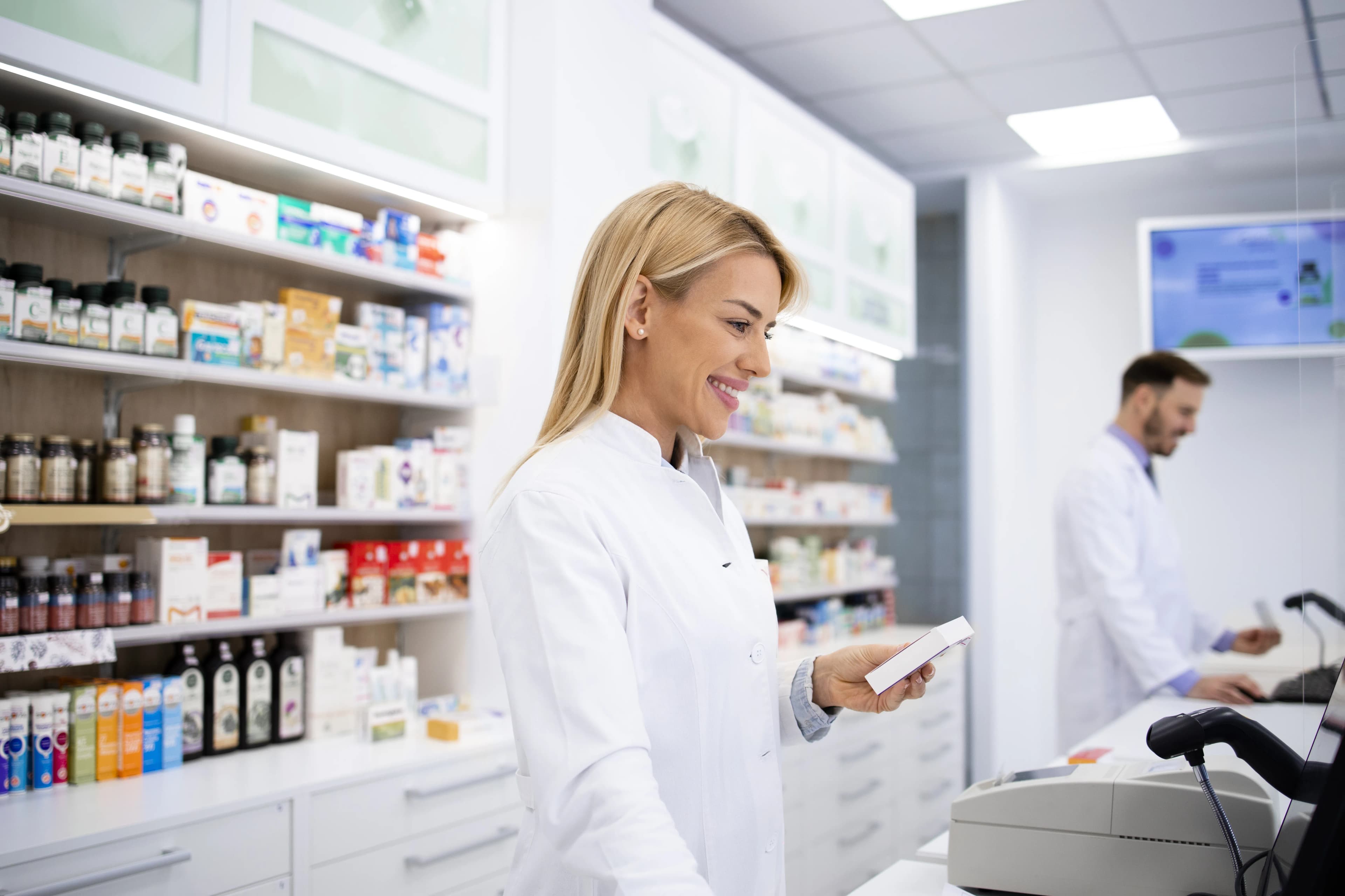 Pharmacist handing a prescription bag to a patient in Antlers Oklahoma